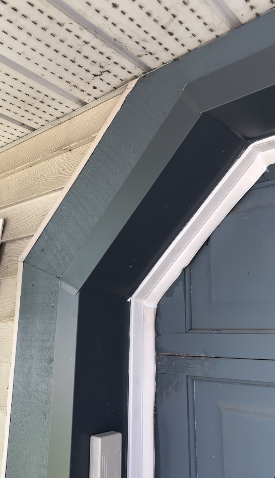 Garage Corner — after: capped in custom-bent aluminum, no more repainting (Calgary)