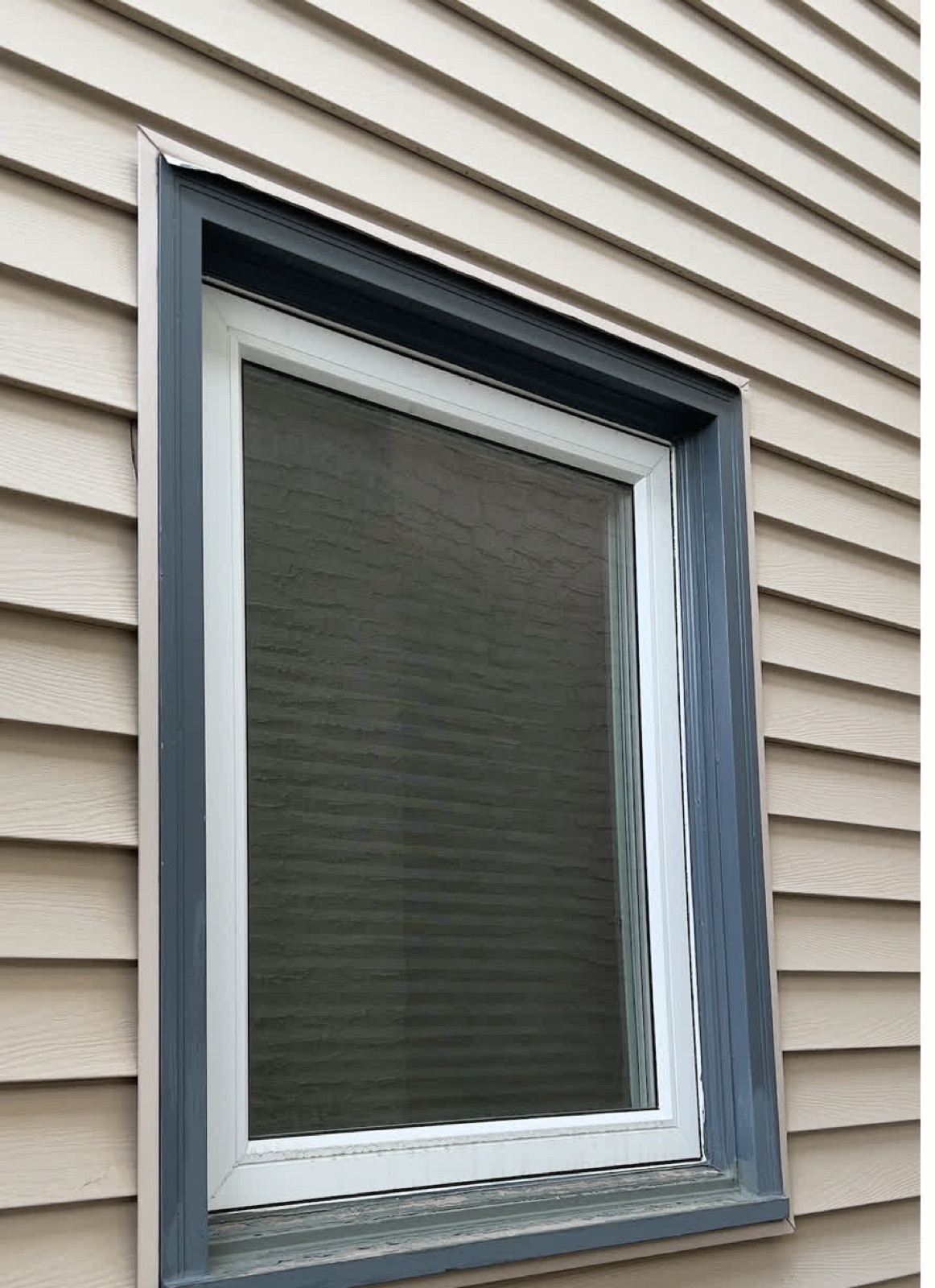 Grey Window — before: worn painted wood trim (Calgary)