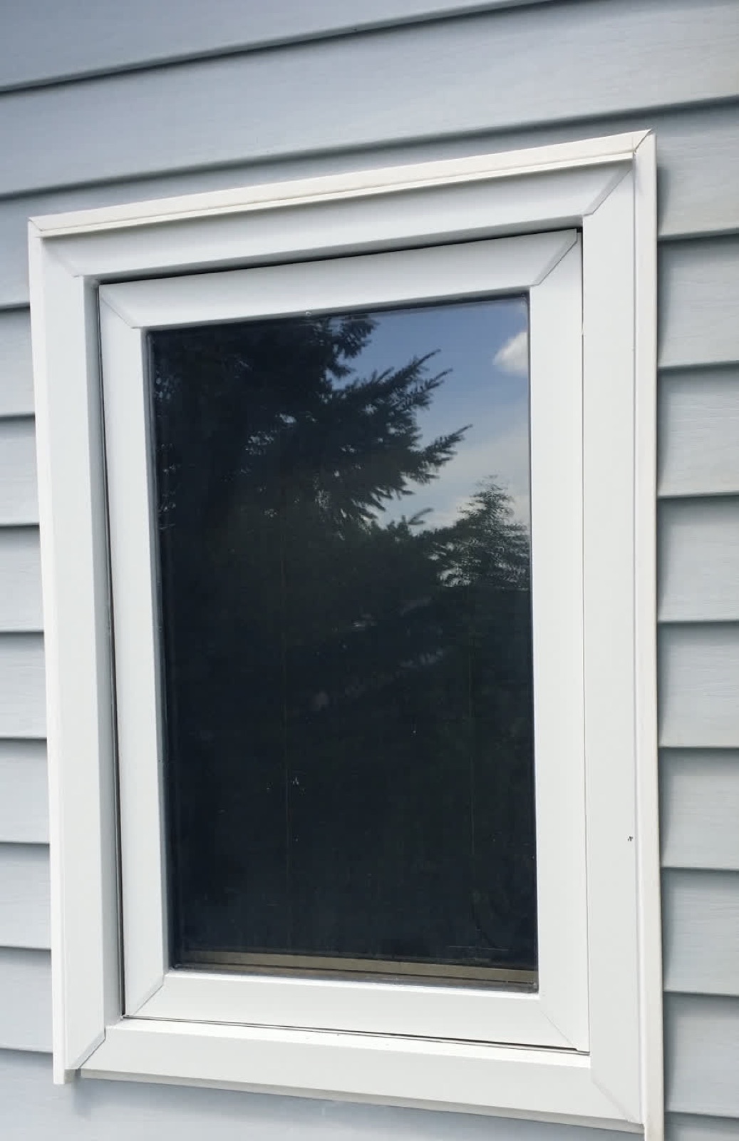 White Window — after: capped in custom-bent aluminum, no more repainting (Calgary)