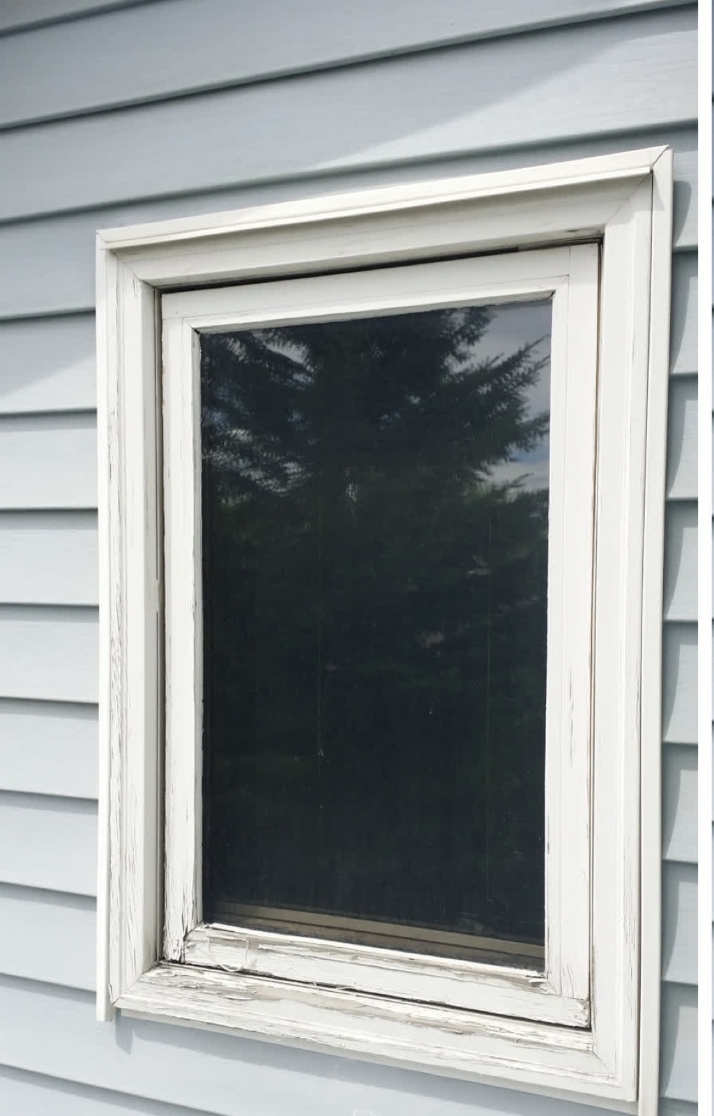 White Window — before: worn painted wood trim (Calgary)